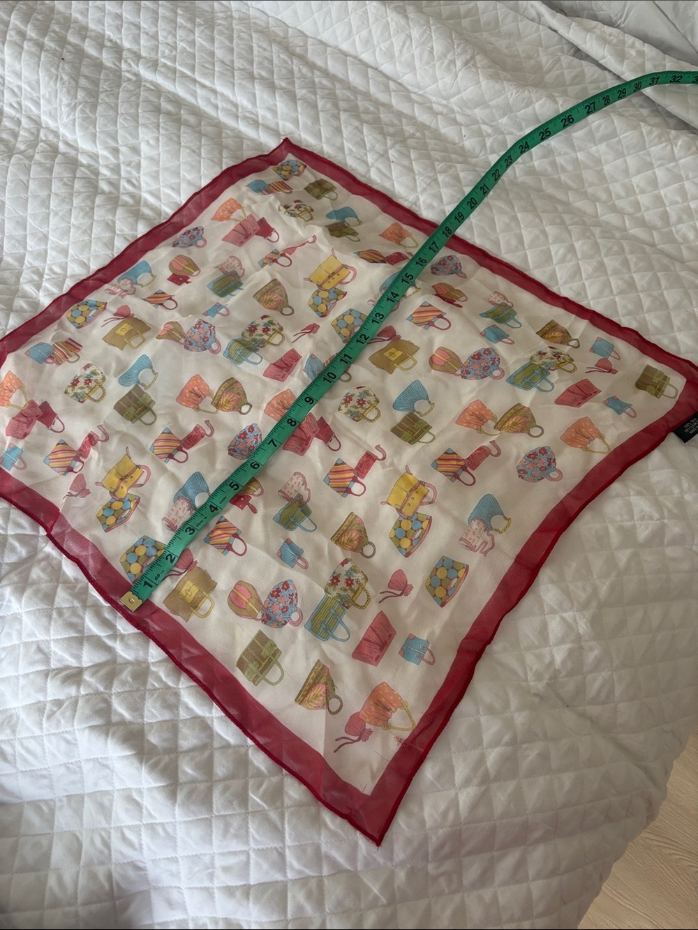 Womans silk scarf with handbag logos